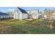 A spacious backyard with a well-maintained lawn and partial fencing around the perimeter of the property at 304 Ashley Woods Ct, Clayton, NC 27527