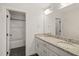 Bright bathroom featuring double sinks, granite countertops, and a bath with a shower at 304 Ashley Woods Ct, Clayton, NC 27527