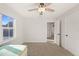A bedroom with a ceiling fan and view through the doorway and a natural light view at 304 Ashley Woods Ct, Clayton, NC 27527