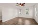 Bright bedroom features smooth wood floors, a modern ceiling fan, and plenty of natural light at 304 Ashley Woods Ct, Clayton, NC 27527