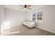 Bedroom with a ceiling fan and natural light from the backyard view through the window at 304 Ashley Woods Ct, Clayton, NC 27527