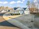 Well-maintained home with a cozy porch and expansive lawn, set on a tree-lined street at 304 Ashley Woods Ct, Clayton, NC 27527