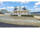 Charming two-story home featuring a large front porch, well-maintained lawn, and inviting curb appeal at 304 Ashley Woods Ct, Clayton, NC 27527