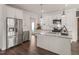 Spacious kitchen features stainless steel appliances, granite counters, and ample storage at 304 Ashley Woods Ct, Clayton, NC 27527