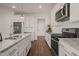 Well-equipped kitchen features granite counters, stainless steel appliances, and ample storage at 304 Ashley Woods Ct, Clayton, NC 27527