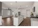 Spacious kitchen features granite countertops, a large island and stainless steel appliances at 304 Ashley Woods Ct, Clayton, NC 27527
