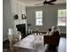 Cozy living room with a fireplace, two windows, and modern decor at 304 Ashley Woods Ct, Clayton, NC 27527