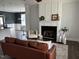 Cozy living room features a fireplace, light walls, and stylish decor on the mantle at 304 Ashley Woods Ct, Clayton, NC 27527