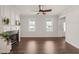 Spacious living room featuring hardwood floors, a cozy fireplace, and abundant natural light at 304 Ashley Woods Ct, Clayton, NC 27527