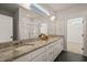 Luxurious bathroom with dual sinks, granite counters, tile floors, and a glass-enclosed shower at 304 Ashley Woods Ct, Clayton, NC 27527