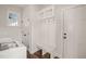 Inviting mudroom features built-in bench, coat hooks, shelving, and access to the home's entrance at 304 Ashley Woods Ct, Clayton, NC 27527