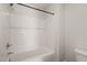 A clean shower and bathtub combo features chrome showerhead, a white surround, and easy to clean fixtures at 304 Ashley Woods Ct, Clayton, NC 27527