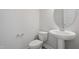 Neat bathroom features a pedestal sink, and a modern toilet at 304 White Oak Garden Way # 214, Garner, NC 27529
