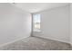 Bright and airy bedroom with plush gray carpeting and a window for natural light at 304 White Oak Garden Way # 214, Garner, NC 27529
