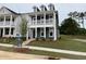 Elegant two-story home with a spacious covered porch and well-maintained landscaping at 304 White Oak Garden Way # 214, Garner, NC 27529