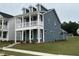Beautiful two-story home featuring a covered front porch and attractive curb appeal at 304 White Oak Garden Way # 214, Garner, NC 27529