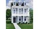 Inviting two-story home with a classic design and a charming covered porch at 304 White Oak Garden Way # 214, Garner, NC 27529