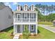 Charming two-story home featuring a welcoming front porch and well-maintained landscaping at 304 White Oak Garden Way # 214, Garner, NC 27529