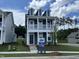 Beautiful two-story home with a covered porch, offering curb appeal and outdoor space at 304 White Oak Garden Way # 214, Garner, NC 27529