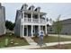 Two-story home with covered porch and dormer windows, offering a blend of style and comfort at 304 White Oak Garden Way # 214, Garner, NC 27529