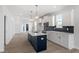 Open kitchen featuring a center island, pendant lights, and stainless steel appliances at 304 White Oak Garden Way # 214, Garner, NC 27529