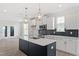 Bright kitchen boasting a center island, pendant lights, and stainless steel appliances at 304 White Oak Garden Way # 214, Garner, NC 27529