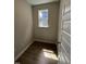 Small room with wood floor and window, providing natural light and cozy feel at 304 White Oak Garden Way # 214, Garner, NC 27529