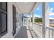 Outdoor balcony featuring white columns, white railing, and exterior shutters at 308 White Oak Garden Way # 215, Garner, NC 27529