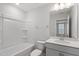 Clean, bright bathroom featuring a tub, toilet, and vanity with a mirror and modern fixtures at 308 White Oak Garden Way # 215, Garner, NC 27529