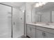Bathroom featuring double sinks, a glass shower, and modern fixtures at 308 White Oak Garden Way # 215, Garner, NC 27529