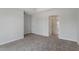 Carpeted bedroom with neutral paint and ensuite bathroom at 308 White Oak Garden Way # 215, Garner, NC 27529