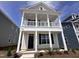 Charming two-story home boasting double porches and classic architectural details at 308 White Oak Garden Way # 215, Garner, NC 27529