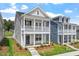 This inviting two-story home features a classic design with a spacious porch and upper balcony at 308 White Oak Garden Way # 215, Garner, NC 27529