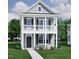 Charming two-story home with a welcoming front porch and classic architectural details at 308 White Oak Garden Way # 215, Garner, NC 27529