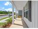 Spacious front porch featuring classic white columns, perfect for relaxing and enjoying the neighborhood scenery at 308 White Oak Garden Way # 215, Garner, NC 27529