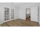 Bright office space featuring French doors, hardwood floors, and access to adjacent room for work at 308 White Oak Garden Way # 215, Garner, NC 27529