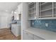 Bright kitchen with quartz countertops, white cabinets, and modern appliances, ideal for home-cooked meals at 308 White Oak Garden Way # 215, Garner, NC 27529