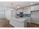 Bright kitchen with quartz countertops, modern appliances, stylish backsplash and open layout, perfect for Gathering time at 308 White Oak Garden Way # 215, Garner, NC 27529