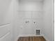 Laundry room featuring hardwood-style floors and hookups for appliances at 308 White Oak Garden Way # 215, Garner, NC 27529