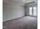 A main bedroom with carpet, recessed lights, and glass paneled doors to the outside at 308 White Oak Garden Way # 215, Garner, NC 27529