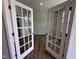 Bright office with glass French doors and wood-look floors, perfect for work at 308 White Oak Garden Way # 215, Garner, NC 27529