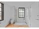 Well-lit bathroom boasts a glass shower enclosure and modern fixtures at 312 N Buchanan Blvd # 302, Durham, NC 27701