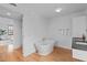 Contemporary bathroom featuring a soaking tub and sleek double vanity at 312 N Buchanan Blvd # 302, Durham, NC 27701