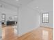 Bedroom with hardwood floors leads to a living space with natural light at 312 N Buchanan Blvd # 302, Durham, NC 27701