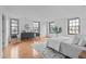 Bright bedroom featuring hardwood floors, large windows, and modern furnishings at 312 N Buchanan Blvd # 302, Durham, NC 27701