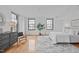 Bright bedroom featuring hardwood floors, large windows, and modern furnishings at 312 N Buchanan Blvd # 302, Durham, NC 27701