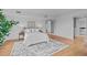 Modern bedroom with hardwood floors, neutral decor, and a glass door at 312 N Buchanan Blvd # 302, Durham, NC 27701