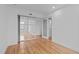 Modern bedroom featuring hardwood floors and glass sliding doors at 312 N Buchanan Blvd # 302, Durham, NC 27701