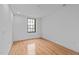 Bright bedroom with hardwood floors and a large window at 312 N Buchanan Blvd # 302, Durham, NC 27701