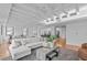 Bright living room with hardwood floors, large sectional couch, and an open concept dining area at 312 N Buchanan Blvd # 302, Durham, NC 27701